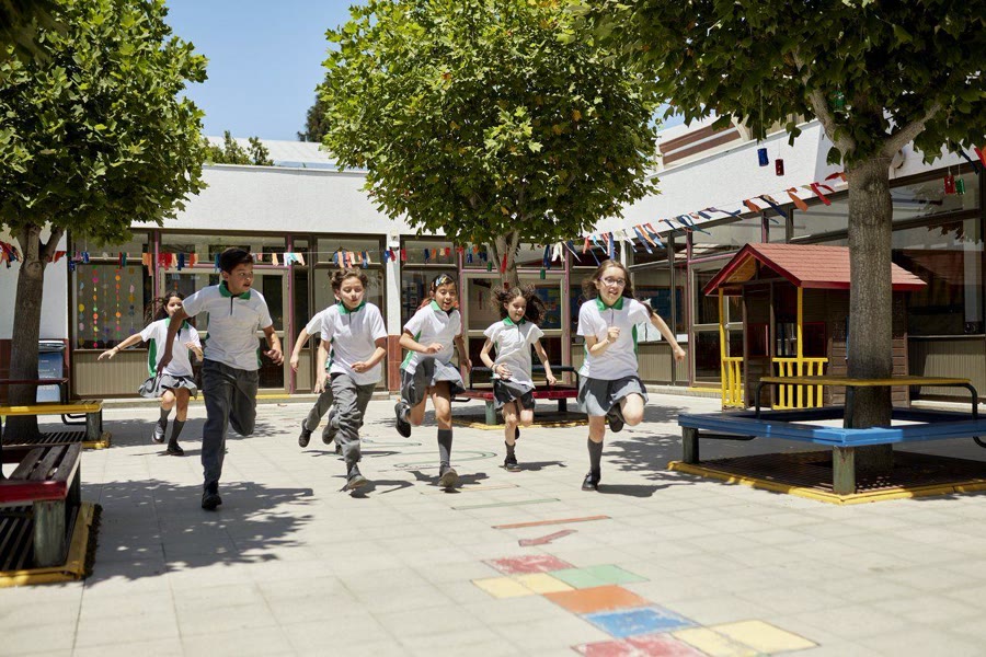 Junior School students running together on a school outing
